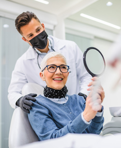 smiling dental implant patient in chair 