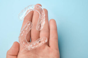 Aligners in an open hand